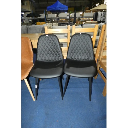 685 - 2 x black upholstered dining chairs