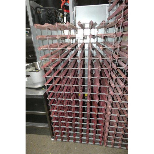 1241 - A large wooden wine rack for approx 112 bottles of wine, size approx 160x72cm