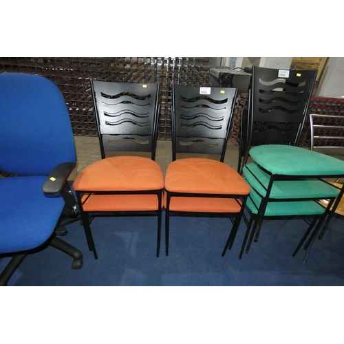 1303 - A set of 4 metal framed chairs with orange upholstered seats