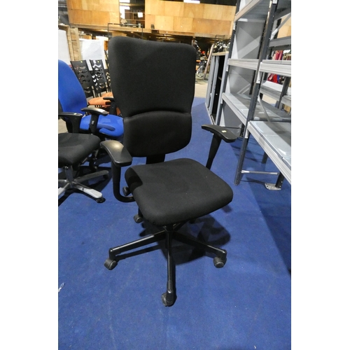 1307 - A black upholstered office swivel chair by Steelcase