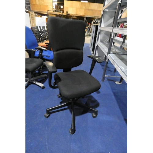 1308 - A black upholstered office swivel chair by Steelcase