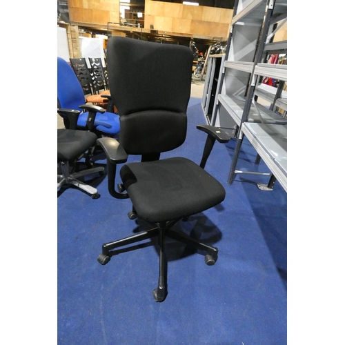 1310 - A black upholstered office swivel chair by Steelcase