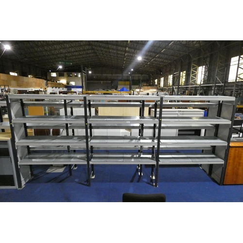 1329 - A quantity of grey metal storage racking comprising of three bays and 12 shelves measuring approx 47... 