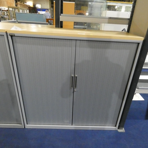 1330 - A grey metal tambour cabinet with light wood effect top measuring approx 120cm x 47cm x 120cm