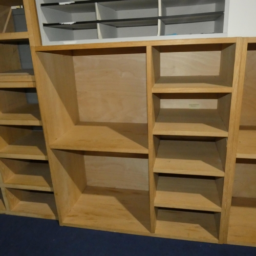 1378 - A wooden pigeon hole unit with two large compartments and five small compartments measuring approx 8... 