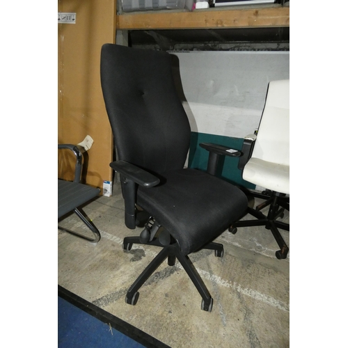 1388 - A black upholstered office swivel chair with lumbar support and high back