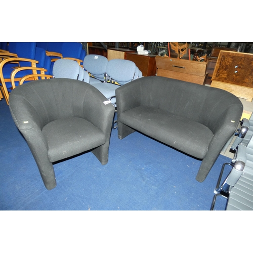 1390 - A black upholstered reception sofa with a matching black upholstered tub chair