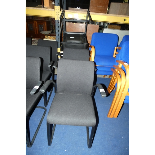 1395 - A set of 4 metal framed cantilever chairs with black upholstered seats