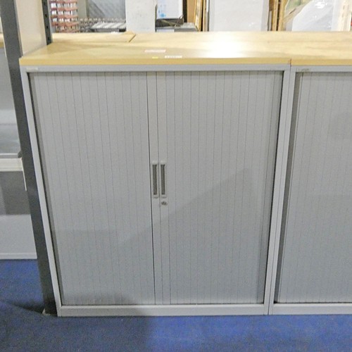 1335 - A grey metal tambour cabinet with light wood effect top measuring approx 120cm x 47cm x 120cm