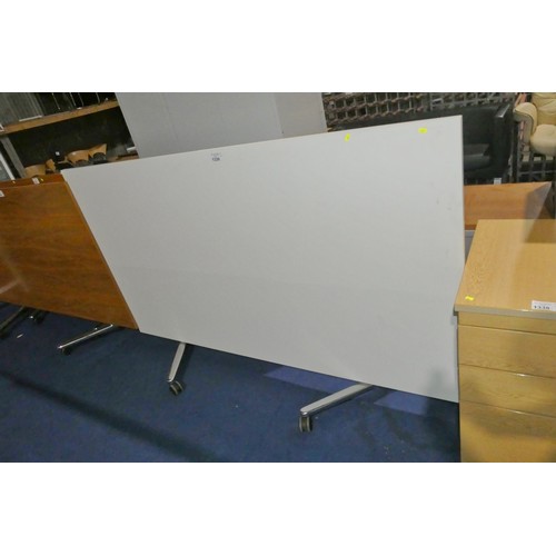 1339 - A white folding table with chrome metal legs measuring approx 20cm x 110cm