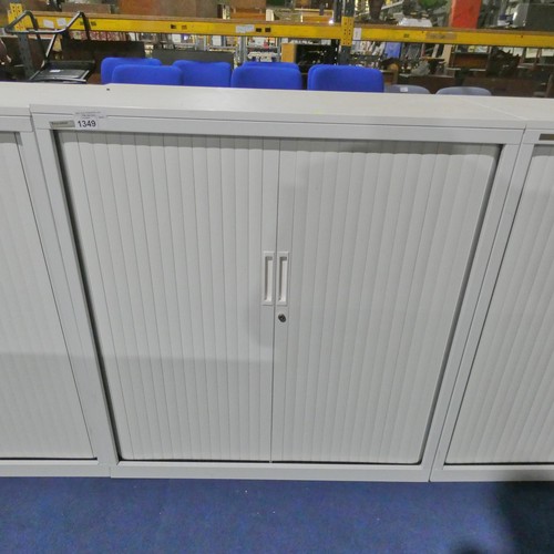 1349 - A white 2 door tambour cabinet by Triumph approx 100x48x110cm