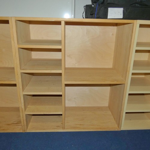 1373 - A wooden pigeon hole unit with two large compartments and five small compartments measuring approx 8... 