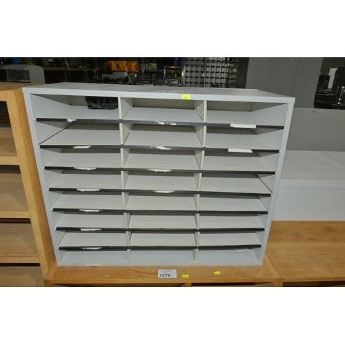 1379 - A grey pigeon hole unit with 24 compartments measuring approx 74 cm x 59 cm x 30 cm