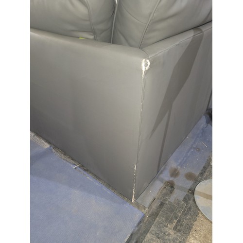 654 - A grey upholstered corner sofa approx 213 x 164cm - Please note that the fabric is torn in several p... 