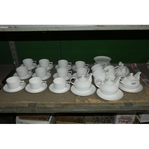 1067 - White crockery by Cashmere : teacups, saucers & 3 teapots