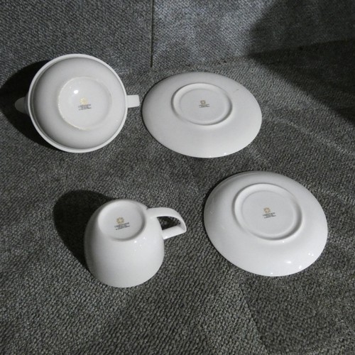 1067 - White crockery by Cashmere : teacups, saucers & 3 teapots