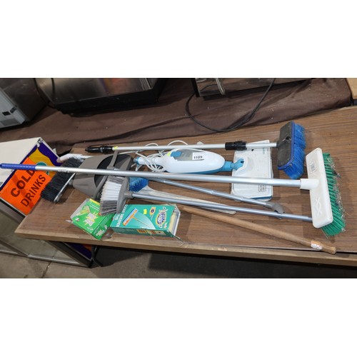 1109 - A quantity of various cleaning related items including a steam mop, brushes etc