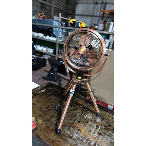 1121 - A copper coloured fan on a tripod stand approx 70cm tall