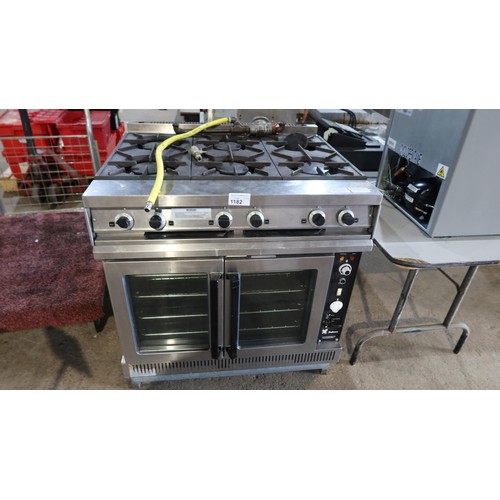 1182 - A commercial stainless steel gas fired 6 ring range with 2 door oven beneath model G102 - trade