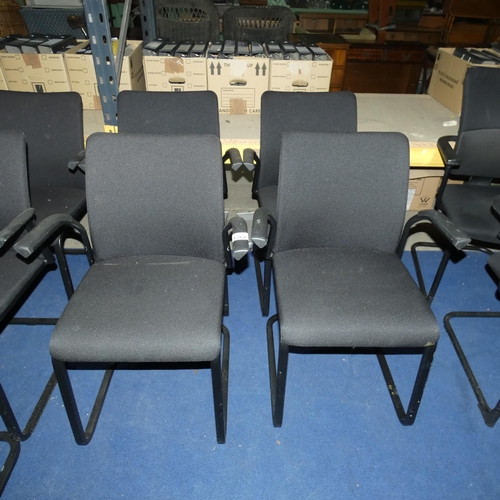 1261 - A set of 4 metal framed cantilever chairs with black upholstered seats