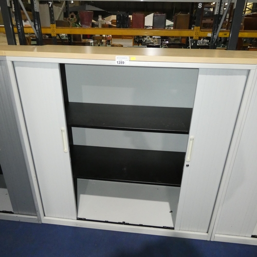 1289 - A white metal 2 tambour door office cabinet by Triumph approx 120x48x121cm