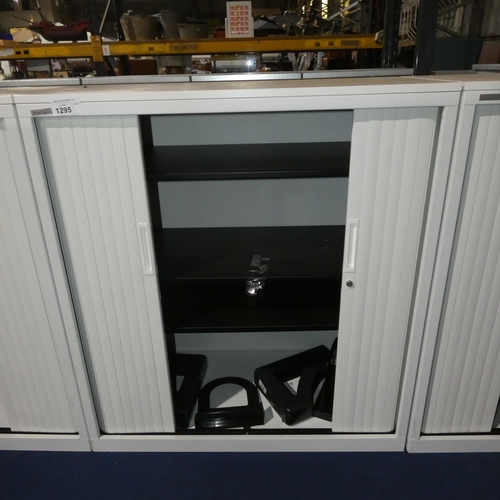 1295 - A white 2 door tambour cabinet by Triumph approx 100x48x110cm