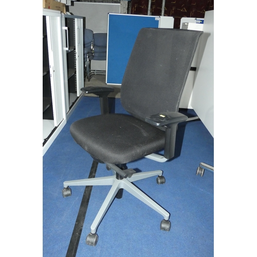 1306 - A black upholstered office swivel chair by Steelcase