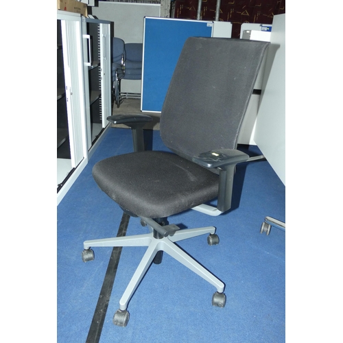 1307 - A black upholstered office swivel chair by Steelcase