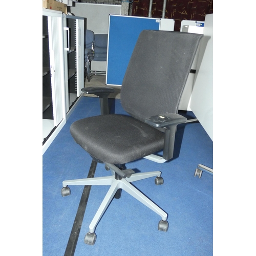 1308 - A black upholstered office swivel chair by Steelcase