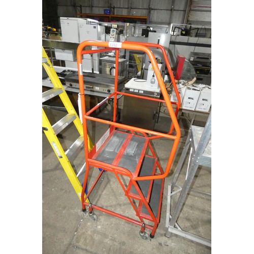 1392 - A set of red mobile warehouse safety steps, working platform