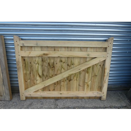 6312 - A pair of wooden gates each measuring approx 164 x 118cm