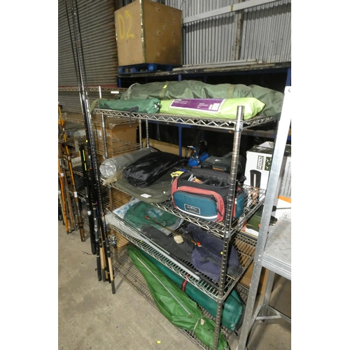 2057 - A quantity of various fishing and camping related items including 5 x various rods, 1 x reel, a shel... 