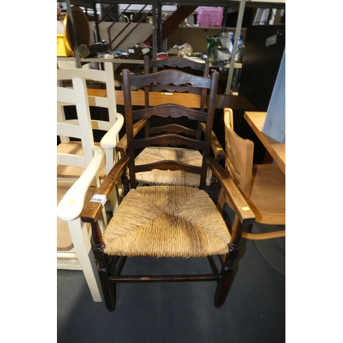 2196 - 2 x dark wood dining chairs with rush seat pads