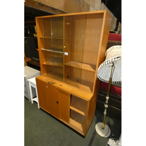 2244 - 1 x vintage two part bookcase with 2 sliding glass doors above and 2 x sliding wood doors below appr... 