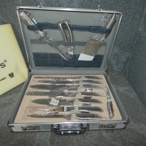 1034 - An 11 piece knife set by Berghaus in a hard flight case with a combination lock