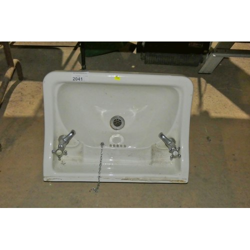 2041 - 1 x white ceramic basin with taps fitted approx 57cm wide