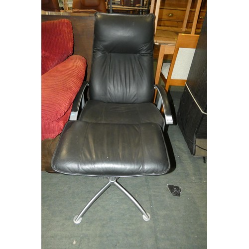 2256 - 1 x black upholstered reclining swivelling lounge type chair with a matching foot stool (no make vis... 