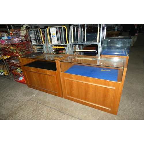 2699 - 2 wooden framed glass topped display cabinets with one key (fits both)