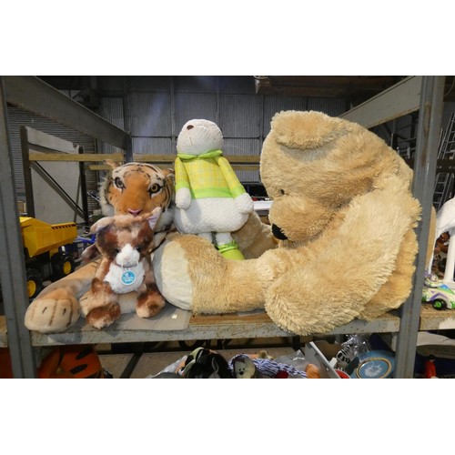 2162 - A quantity of various soft toys and 1 x small rug. Contents of 1 bay /3 shelves