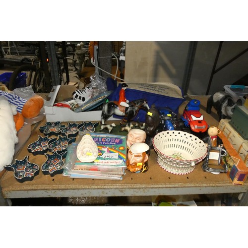 2163 - A quantity of various items including ornaments, a parrot table lamp 240v, dolls, toy tractors. Cont... 