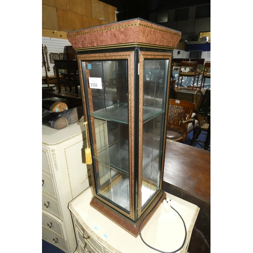 A small decorative table top display cabinet with glazed panels and a ...