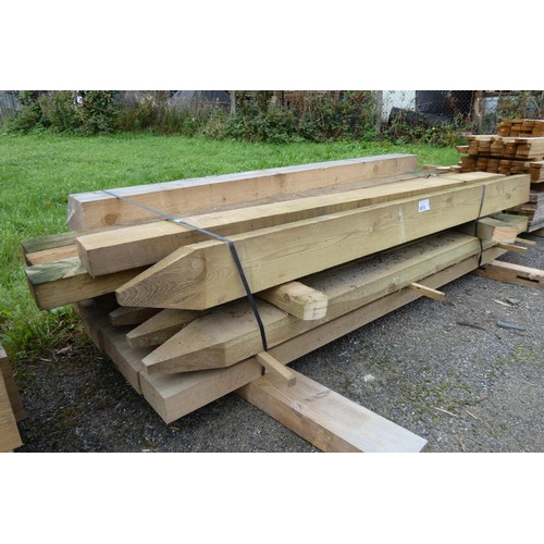 6010 - 17 wooden stakes each measuring approx 7 cm x 14 cm x 210 cm, and a wooden post measuring approximat... 