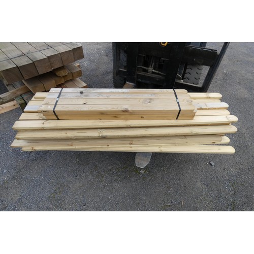 6011 - A quantity of round top palisade pales measuring approximately 7 cm x 2 cm, lengths vary up to appro... 