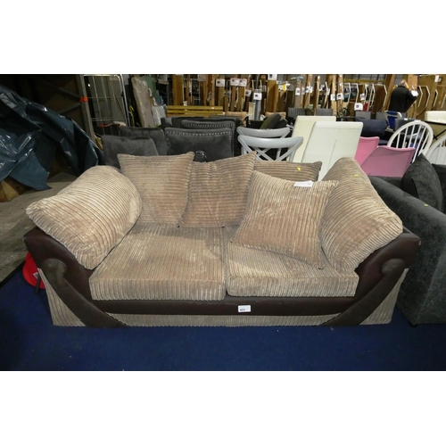 621 - A two tone brown upholstered two person sofa approx 185cm wide. Please note that there is light dama... 