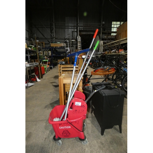 2065 - 1 x wheeled mop bucket, 2 x mops and 1 other long handled cleaning tool