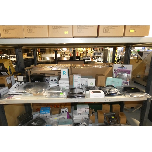 2443 - A quantity of various electronic related items including charging cables, lights plugs, headphones e... 