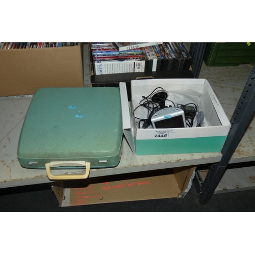 2445 - A vintage typewriter in a case and a Sony NAV-U Satnav - trade