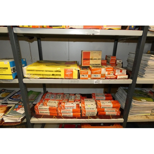 3071 - A quantity of Fleischman HO model railway rolling stock, track and controllers etc. (two shelves)