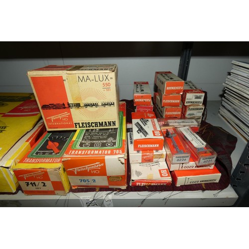 3071 - A quantity of Fleischman HO model railway rolling stock, track and controllers etc. (two shelves)