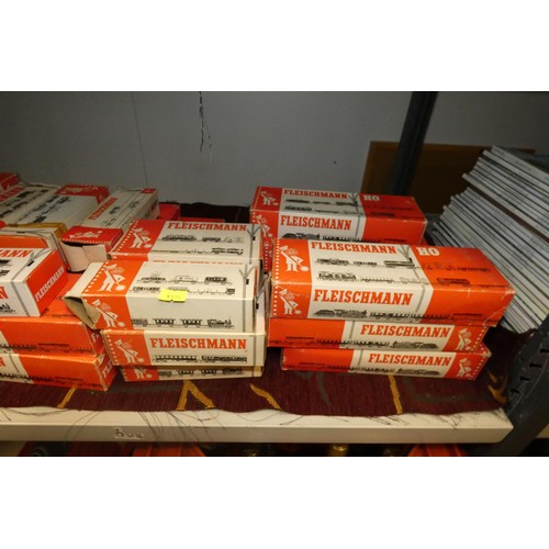 3071 - A quantity of Fleischman HO model railway rolling stock, track and controllers etc. (two shelves)